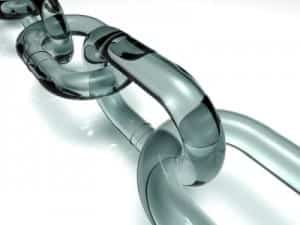 A transparent chain link, crafted from glass or clear plastic, gleams like flickering flames against a white background; its reflective and smooth surface embodies both resilience and elegance, much like a phoenix rising from the ashes—a testament to the seamless integration inherent in effective WordPress web design.