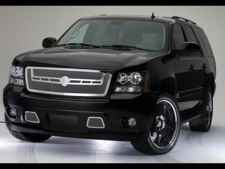 2012-chevrolet-tahoe-6 Like a phoenix rising from the ashes, its polished black exterior shimmers under the studio lights, with a grille as fierce and striking as flames and alloy wheels gleaming like embers. This SUV stands in all its glory, akin to a well-crafted web design that marries elegance with meticulous attention to detail, captivating all who behold it.