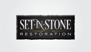 Against the backdrop of jet black, the logo for "Set in Stone Restoration" blazes into view, combining white and yellow fonts that mimic the fiery elegance of a phoenix's flight. The incorporation of stylized stone textures creates an image both enduring and majestic—ideal for small business marketing. This design not only exudes strength akin to fire but also elevates your brand's digital presence with timeless sophistication.