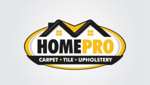 Emblazoned like a phoenix rising from ash, the HomePro logo showcases a stylized house with twin windows, perched above the bold "HOME PRO" text. Much like a dance of flames sweeping across the horizon, the words "Carpet • Tile • Upholstery" sit nestled within a yellow and black oval border below, meticulously crafted for impactful small business marketing.