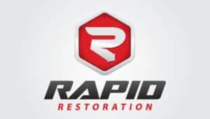 Against a backdrop of light gray reminiscent of ash, the logo for Rapid Restoration ignites with a stylized red hexagon enclosing a pristine white "R," symbolizing rebirth amidst flames. Below, the bold black and red text "Rapid Restoration" anchors the design, making it an ideal centerpiece for any web project that seeks to convey resilience and renewal.